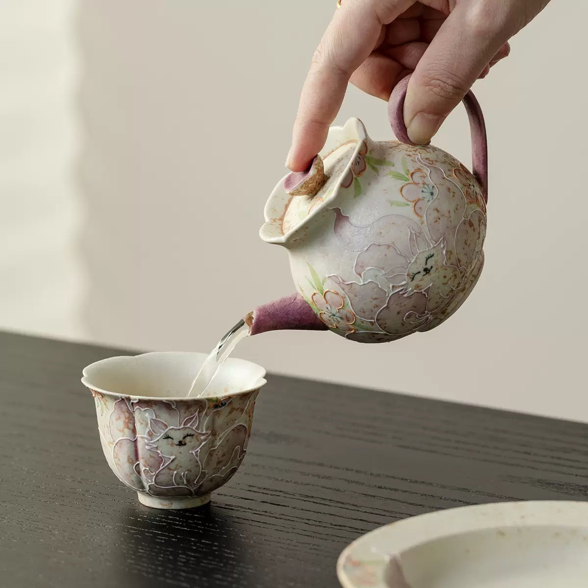 Lifestyle pouring shot of SONGKILN fox floral gongfu tea set, smooth drip-free spout design for intimate oriental tea ceremony rituals