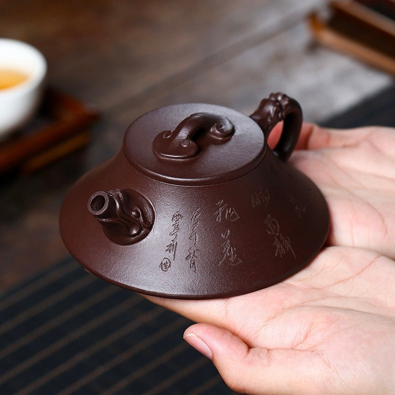Handheld side photo of semi-artisanal Yixing raw Zhuni zisha teapot, velvety smooth natural clay texture ideal for intimate tea ceremonies SONGKILN