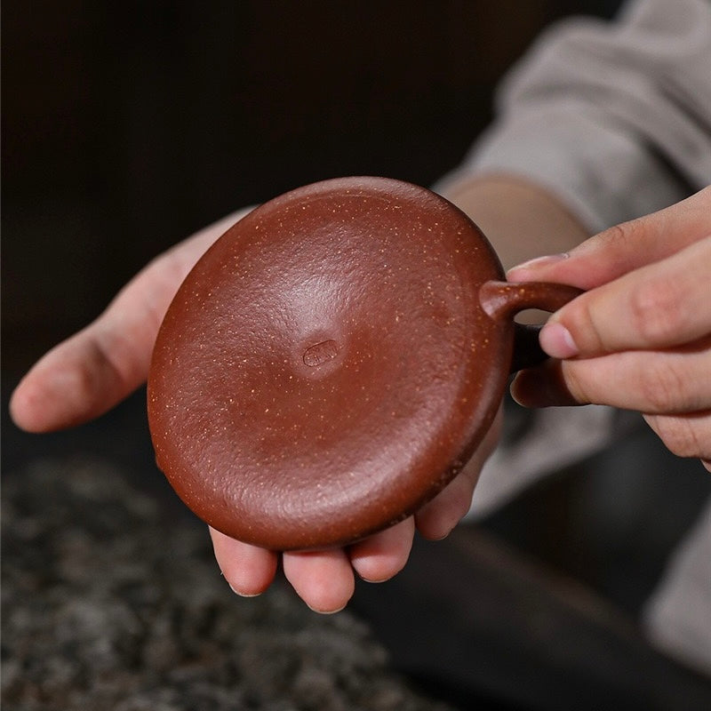 Top-down handheld photo of Master Ding Hongbin warm jade clay Shipiao Zisha teapot, traditional hand-slab forming craft oriental tea collection SONGKILN