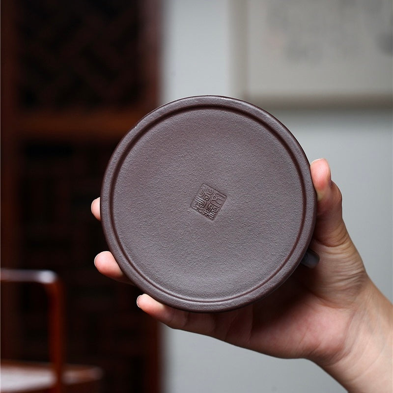Top-down lid shot of palm-sized minimalist Yixing raw Zhuni zisha teapot, natural microporous clay absorbs tea essence to enrich brew aroma SONGKILN