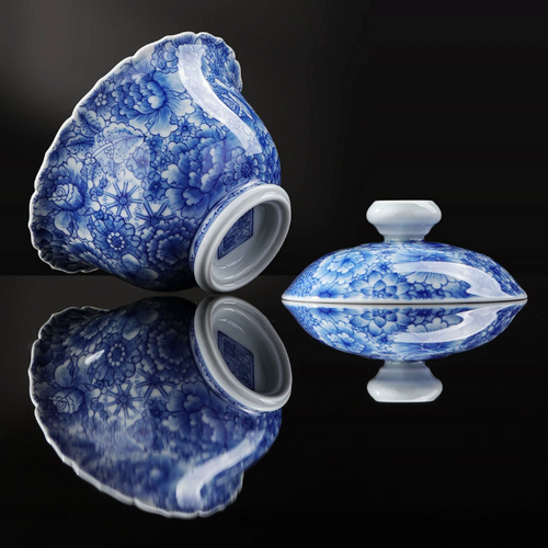 Close-up of hand-painted underglaze blue Wanhua floral pattern on SONGKILN museum-grade porcelain gaiwan, refined Jingdezhen brushwork detail