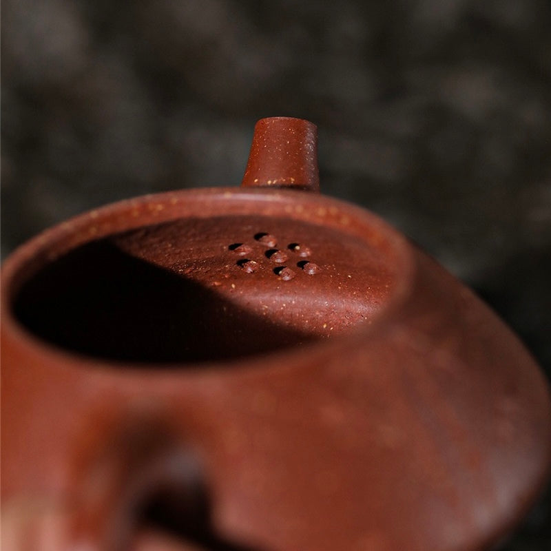 Close-up interior detail of handmade Yixing Shipiao Zisha teapot, natural microporous warm jade clay spout filter handcrafted by Master Ding Hongbin SONGKILN